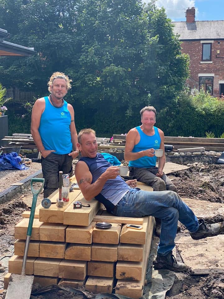 Noel, Marc and the team taking a coffee break beside stacked oak sleepers